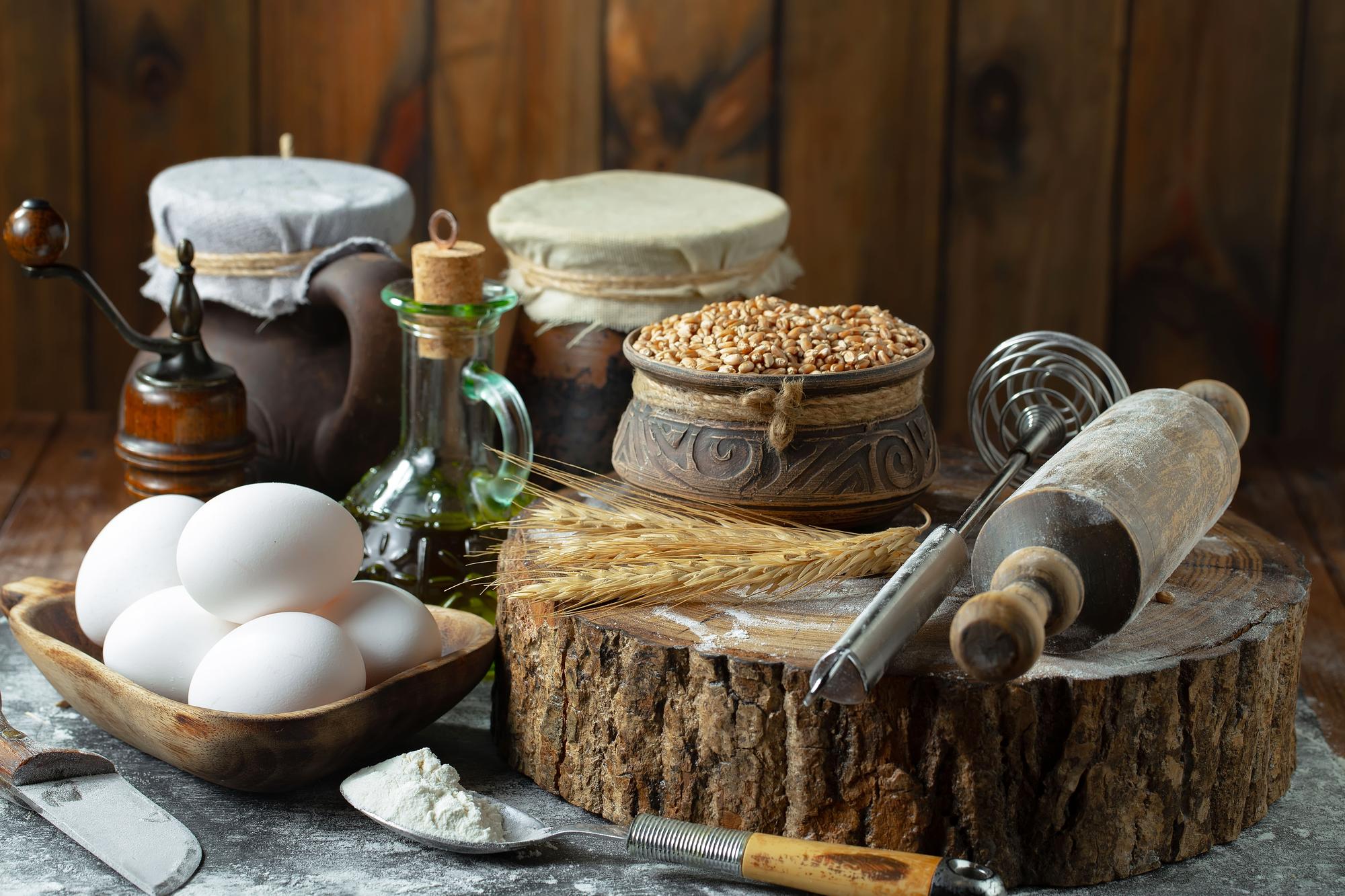 Workshop table with dough, herbs and wooden tools